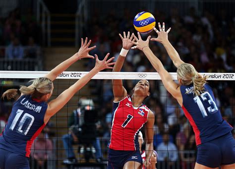 Work on passing and setting skills first with the beginners. Those two skills allow players to run more complex drills. When players know how to set and bump, they are able to run game-like drills and start playing volleyball back and forth over the net. Follow with serving, blocking, spiking and digging skills, etc.